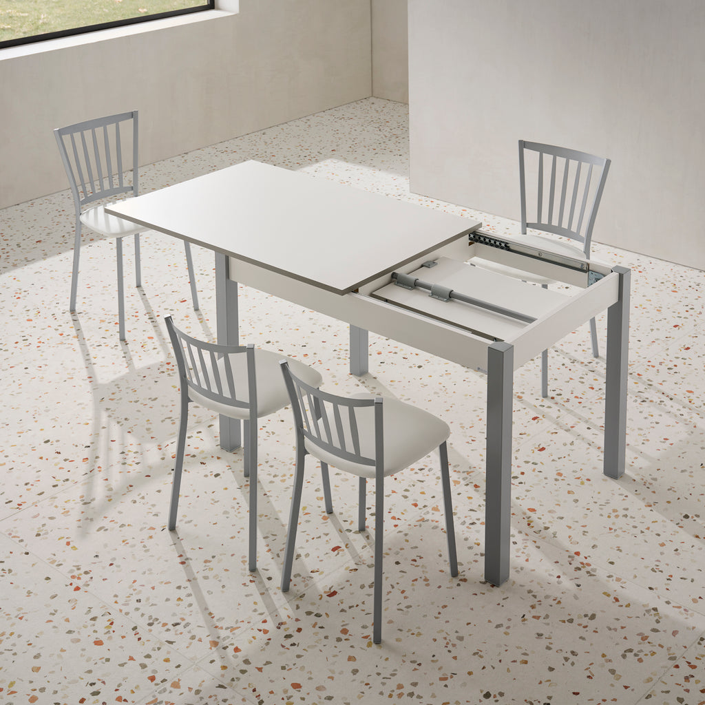 V VELASCO Mesa de Cocina Extensible Arona | Mesa de Comedor Rectangular 100x60 cm a 140x60 cm | Encimera Blanca con Armazón y Patas Metálicas de Color Aluminio, Diseño Moderno para Espacios Pequeños
